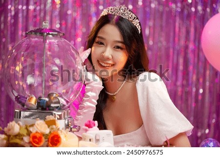 Happy beautiful Asian girl in princess dress showing birthday cake. Birthday princess photography theme is popular in social network. Royalty-Free Stock Photo #2450976575