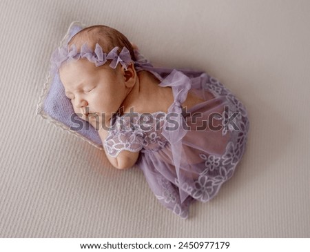 Newborn Girl In Lace Dress Sleeps In Lavender Tones Photo
