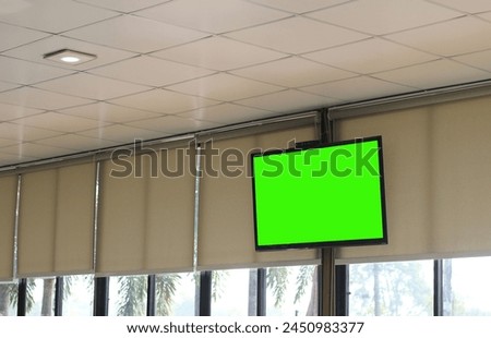 TV screen is blank green in the cafe.
