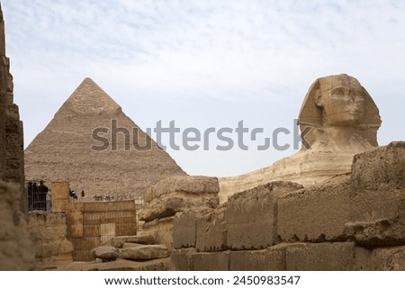 The Great Sphinx and the Pyramid of Khefre in Giza, Egypt. They were built during the Fourth Dynasty of the Old Kingdom Royalty-Free Stock Photo #2450983547