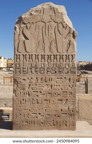 Stele at the the Karnak Temple Complex in Luxor, Egypt. The Complex cpmprises a vast mix of temples, pylons, chapels and other buildings. Construction began during the reign of Senusret I,  Royalty-Free Stock Photo #2450984095