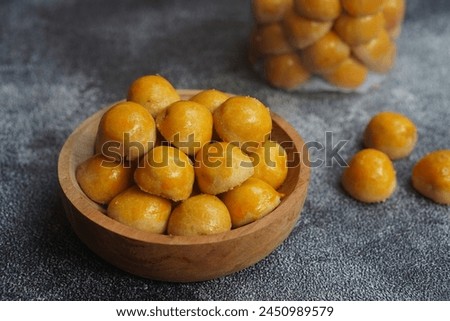 Nastar Cookies, Pineapple tarts or nanas tart are small, bite-size pastries filled or topped with pineapple jam, commonly found when Hari Raya or Eid Al Fitr or Lebaran. Selective focus. Royalty-Free Stock Photo #2450989579