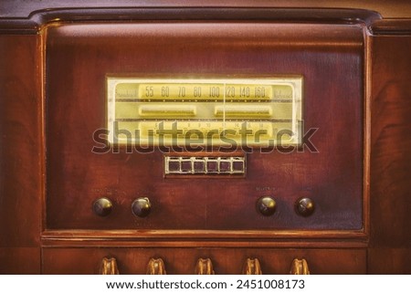 Early twentieth century wooden tube radio with illuminated display Royalty-Free Stock Photo #2451008173