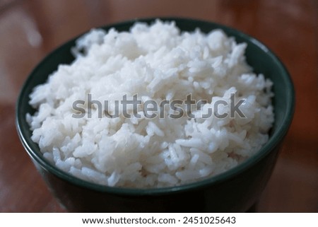 One bowl of white rice on a brown wooden table, food, stock photo.