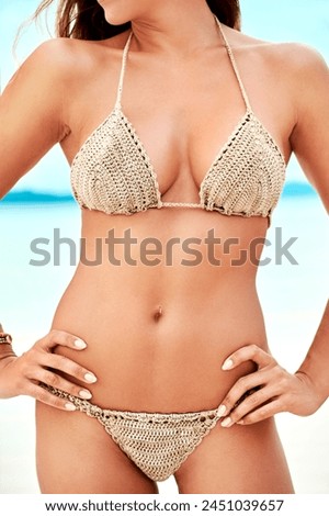 Woman, bikini and body on vacation at beach with organic material for adventure, freedom and healthy in summer. Girl, person and fashion by ocean, sea and water in cotton swimwear for sustainability