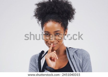African woman, portrait and finger with secret, studio and silence for mystery announcement. Model, gossip and hush with rumor, whisper and gesture for news or noise with privacy on white background