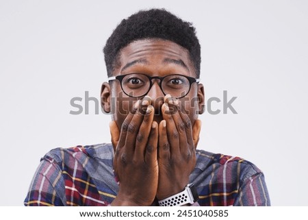 Studio background, shocked and black man in portrait with mockup space, wow and mind blown with good news. Surprised, male person and omg reaction for announcement, lottery or competition prize