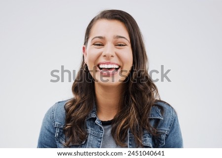 Portrait, woman and happy with laugh by studio background for mockup space, comic joke and excited expression. Smile, isolated and female person by grey backdrop for happiness, meme and gen z comedy