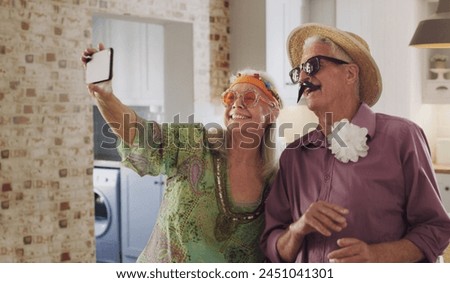 Senior couple, selfie and costume in home, silly and goofy glasses for social media in retirement. Elderly people, capture moment and camera app for picture, photo and hipster accessories for fun