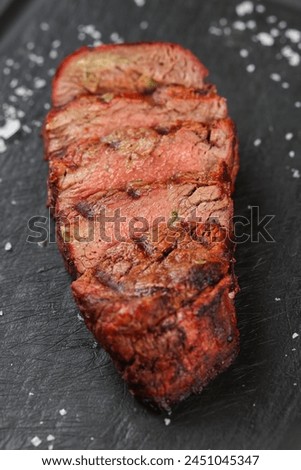 Skirts steak top view. Close up photo with a delicious beef diaphragm steak medium rare cooked on barbecue grill. Beef source of protein.