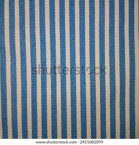 clothing fabric with checkered patterns in shades of  dark blue and white