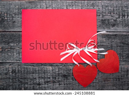 postcard with hearts on a wooden background 