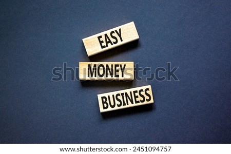 Easy money business symbol. Concept words Easy money business on beautiful wooden blocks. Beautiful black table black background. Easy money business concept. Copy space.