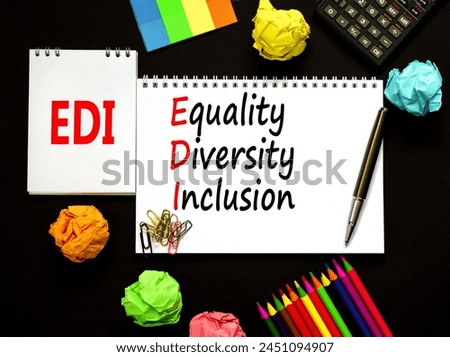 EDI equality diversity inclusion symbol. Concept words EDI equality diversity inclusion on white note. Beautiful black background. Business EDI equality diversity inclusion concept. Copy space.
