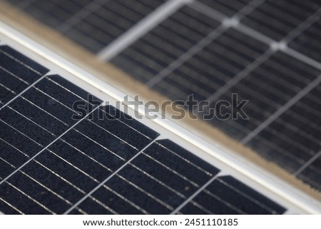 Solar panels on the house roof. Close up photo with solar panels covered with dust on top of a house at countryside. Green eco source of energy. Solar energy industry.