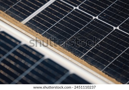 Solar panels on the house roof. Close up photo with solar panels covered with dust on top of a house at countryside. Green eco source of energy. Solar energy industry.