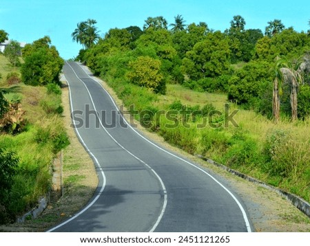 Bending the road can enhance the visual appeal of the surrounding landscape by creating interesting vistas and avoiding long, monotonous stretches of straight road