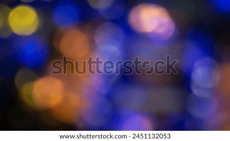 Defocused neon glow. Overlay of light highlights. Colorful bokeh. Futuristic LED lighting. Blur of colors on dark abstract background