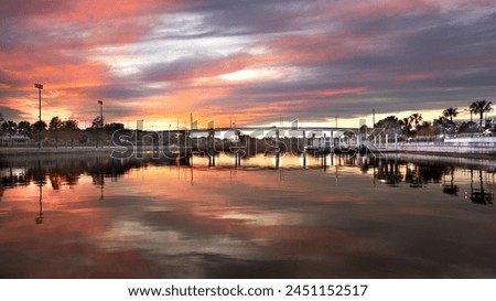 Sunset at Tampa Riverwalk with bridge and buildings