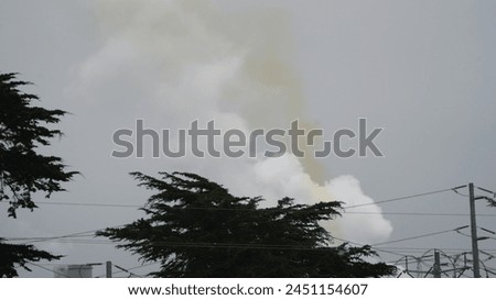 Power Plant Smoke Stack Releasing Yellow Smoke (Nitrogen Oxide). Royalty-Free Stock Photo #2451154607