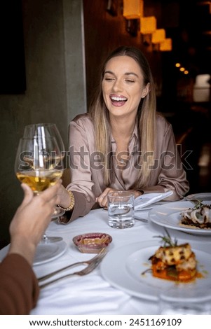 Anica having dinner at a gourmet fine dining restaurant