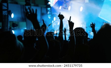People arms raised at the concert