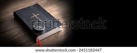 Bible on wooden table, compass on it, word of God as guidance concept Royalty-Free Stock Photo #2451182447