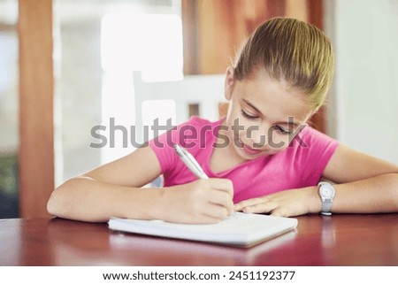 Young girl, writing and homework at table for school, study and paper in house for education. Notebook, student and pencil for development, creating and homeschool indoors for drawing and art Royalty-Free Stock Photo #2451192377