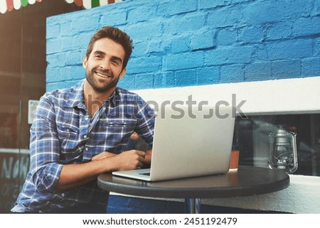 Man, thinking and busy in cafe on laptop, remote work and internet job on technology for digital networking. Smile, copywriting on social media platform, online career and idea for creative blog