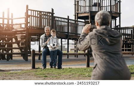 Grandparents, child and cellphone picture at park for bonding with soccer ball, playground and photography. Person, back and smartphone photo for family memory or social media, post or online