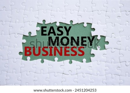 Easy Money Business symbol. Concept words Easy Money Business on white puzzle. Beautiful grey green background. Business and Easy Money Business concept. Copy space.