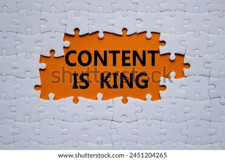 Content is king symbol. Concept words Content is king on white puzzle. Beautiful orange background. Business and Content is king concept. Copy space.