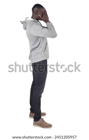 side view of a man covering her face with her hand on white background