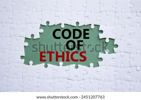 Code of ethics symbol. Concept words Code of ethics on white puzzle. Beautiful grey green background. Business and Code of ethics concept. Copy space.