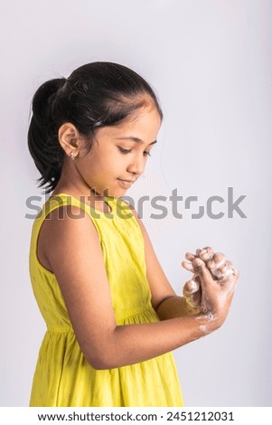 child girl washing hands with soap. Hands hygiene and virus infections prevention. Indian hygiene visuals.
