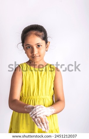 child girl washing hands with soap. Hands hygiene and virus infections prevention. Indian hygiene visuals.