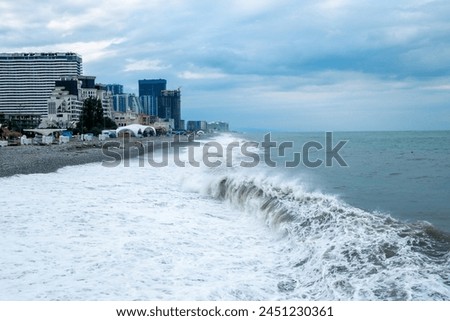 surf and city view on the shore