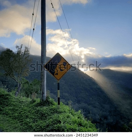 Danger sign in the sunset on a road side in the blue mountains of Jamaica