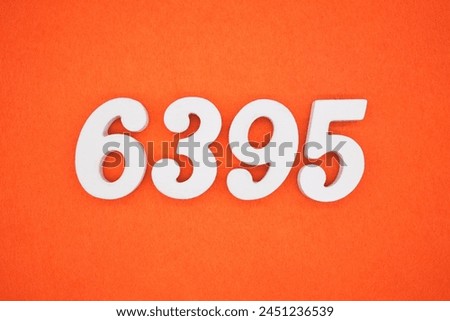 Orange felt is the background. The numbers 6395 are made from white painted wood.