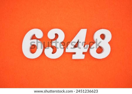 Orange felt is the background. The numbers 6348 are made from white painted wood.