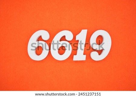 Orange felt is the background. The numbers 6619 are made from white painted wood.