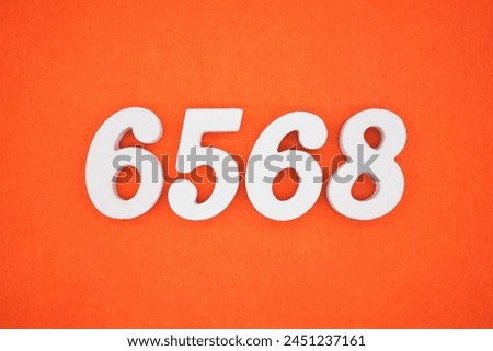 Orange felt is the background. The numbers 6568 are made from white painted wood.