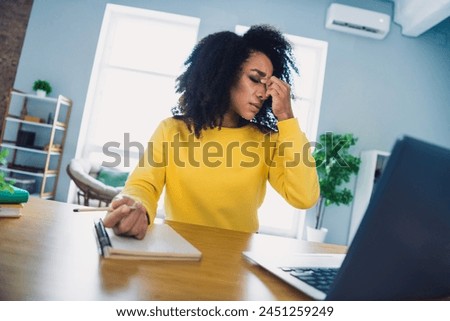 Photo of tired sad upset cute woman sitting table working writing report office workspace