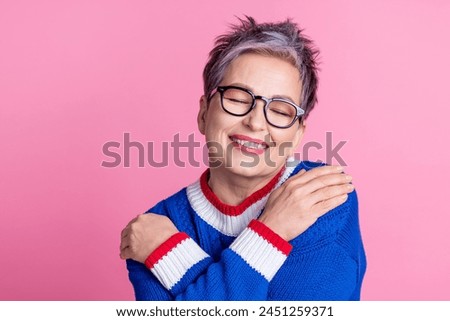Photo of charming lovely pensioner woman wear blue trendy clothes hug herself dream closed eyes isolated on pink color background Royalty-Free Stock Photo #2451259371