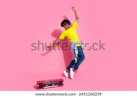 Photo of funny positive man dj clubber wear stylish yellow clothes have fun night club isolated on pink color background