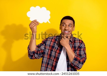 Photo of minded smart man with stylish haircut dressed plaid shirt look at mind cloud empty space isolated on yellow color background