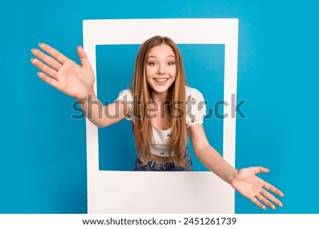 Photo of nice young girl raise opened arms album card wear top isolated on blue color background