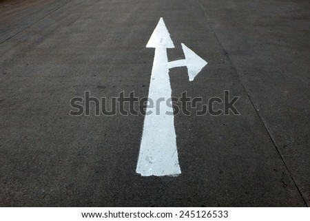 Arrow traffic sign on the road