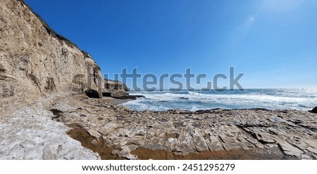 Panoramic landscape photo of cliffs and cove