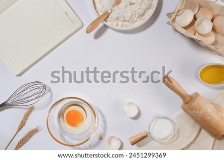 Blank space in the middle of picture with some baking ingredients and utensils surrounded, scene from top view. Empty space for displaying or presenting product